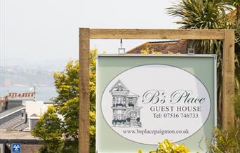 Signboard with view B's Place Paignton