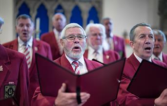 Brixham Orpheus Male Voice Choir Annual Concert St Mary's Square Brixham male singers inside a church