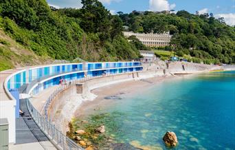 Blue beach huts at Meadfoot beach in Torquay, Devon