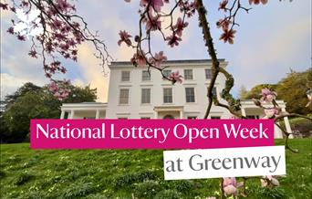 White house with pink flowers and text across the front, reading National Lottery Open Week at Greenway, National Trust