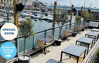 Outside seating overlooking Torquay Harbour at Otto