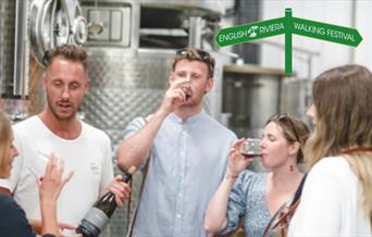 A group of people taste wines at Sharpham Wines, Sandridge Barton