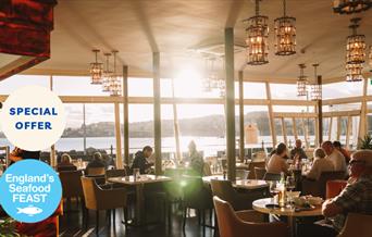 Pier Point’s Perfect Pairing, interior of Pier Point with sea in the background.