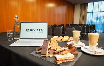 Laptop with refreshments in the Grace Murrell Suite, Riviera International Centre, Torquay, Devon