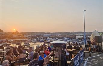 Outside seating at The Still House, Paignton Harbour, Paignton, Devon