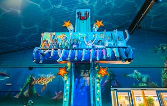 a group of young riders enjoying a sea life themed ride at crealy theme park