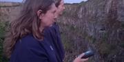 Two people looking for bats,Twilight Bat Walks, Berry Head, Brixham