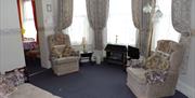 Lounge area at Sandmoor Holiday Apartments, Paignton, Devon