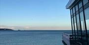 Balcony overlooking Paignton Beach at Shoreline Restaurant, England's Seafood Feast