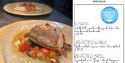 A prepared dish of fresh fish with tomato at Portofino restaurant, Wellswood, Torquay. And image of Seafood Feast menu. Part of England's Seafood FEAS