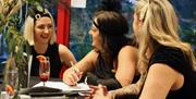 Customers laughing at the Paignton Zoo Murder Mystery