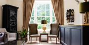 Interior - bar - chairs and furnishings by large window at the Haytor Hotel, Torquay