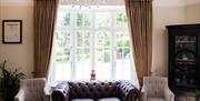 Interior - bar with sofa, chairs, chandelier, at the Haytor Hotel, Torquay