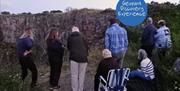 Group of people watching for the Twilight Bat Walk, Berry Head, Brixham