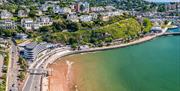 Aerial view of Torre Abbey Sands and Torquay harbour