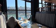 Interior, seating with Brixham Harbour view, Taste of the Sea at Beamers Restaurant