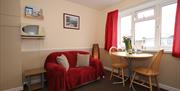 Dining area at Big Tree Holiday Flats, Paignton, Devon