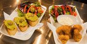 images of the trio and food from the menu