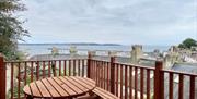 Decking area with seating, at Coastal View Cottage, Ranscombe Road, Brixham