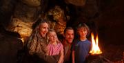 Family inside Kents Cavern Caves, Torquay