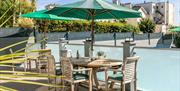 Seating by the pool, Devon Court Luxurious Bed & Breakfast, Croft Road, Torquay, Devon