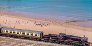 Steam train going past at Goodrington Sands in Paignton, Devon