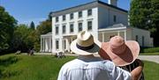 Greenway House with guests looking on