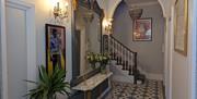 Hallway with contemporary artwork and beautiful tiles flooring.