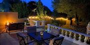 Patio area at night, The Hamptons, 1 Ansteys Mews, Torquay, Devon