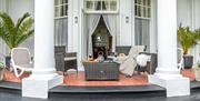 Venezia apartment outside private terrace with rattan outside furniture and sunloungers