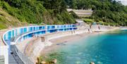 Blue beach huts at Meadfoot beach in Torquay, Devon