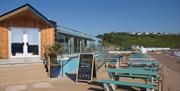 Outside dining area by seafront at Venus Cafe Broadsands Beach Paignton