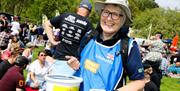 RNLI charity collector with donations bucket at Offshore and Bays Festival