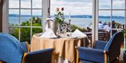 Dining taable laid for two at the Berry Head Hotel in Brixham, with sea views