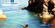 Kayakers in the sea, English Riviera UNESCO Global Geopark.