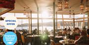 Pier Point’s Perfect Pairing, interior of Pier Point with sea in the background.