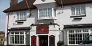 photos of the interior and exterior of the pub
