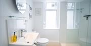 Ensuite bathroom, low profile walk-in shower.