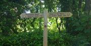 Directional signpost, Tall Tales and Sea Shanties, part of the UNESCO Geopark Festival and a Geopark Experience