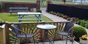 Outside seating and gardens at Sefton Lodge