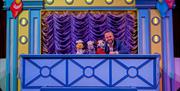 enjoy the sooty and sweep show at crealy theme park