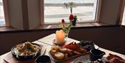 Inside table with view at Tides Torquay
