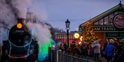 Train of Lights steam locomotive boarding customers at Queen's Park Station.