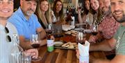 Group of people wine tasting at The Wine Loft, 42 Middle Street, Brixham