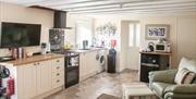 Fully-fitted open plan kitchen at Court Prior Luxury Apartment, Torquay, Devon