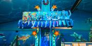 a group of young riders enjoying a sea life themed ride at crealy theme park