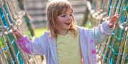 young girl enjoying the playground at crealy theme park