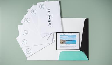 Surprise Trip Pack laid out with all the envelopes