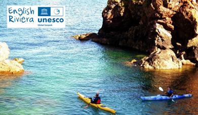 Kayakers in the sea, English Riviera UNESCO Global Geopark.