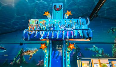 a group of young riders enjoying a sea life themed ride at crealy theme park